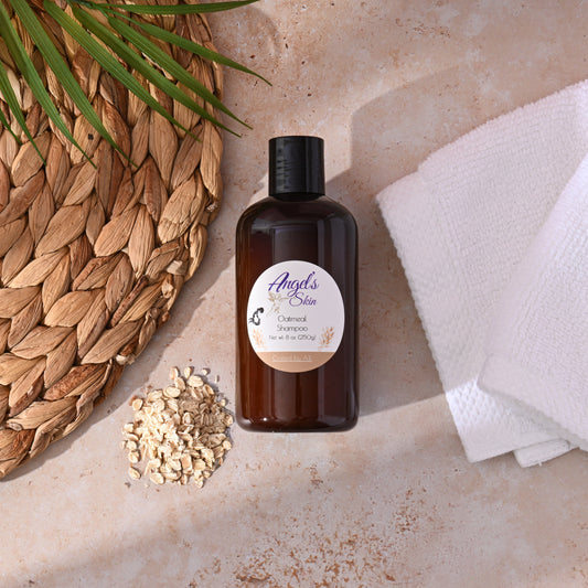 8 oz bottle of Angel's Skin Oatmeal Shampoo, chemical-free moisturizing formula for all hair types, surrounded by oats and towel.