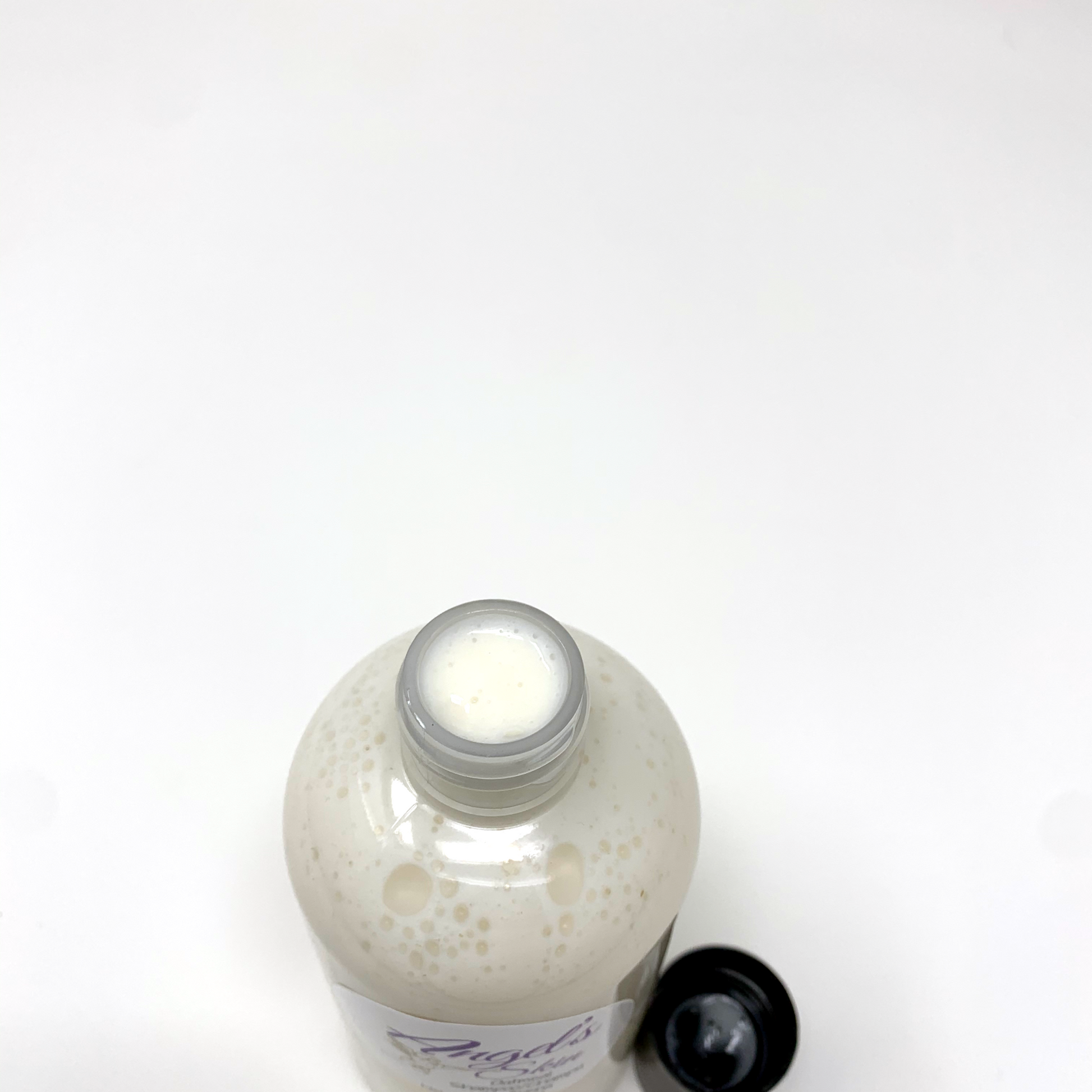 Oatmeal Shampoo top with cap off