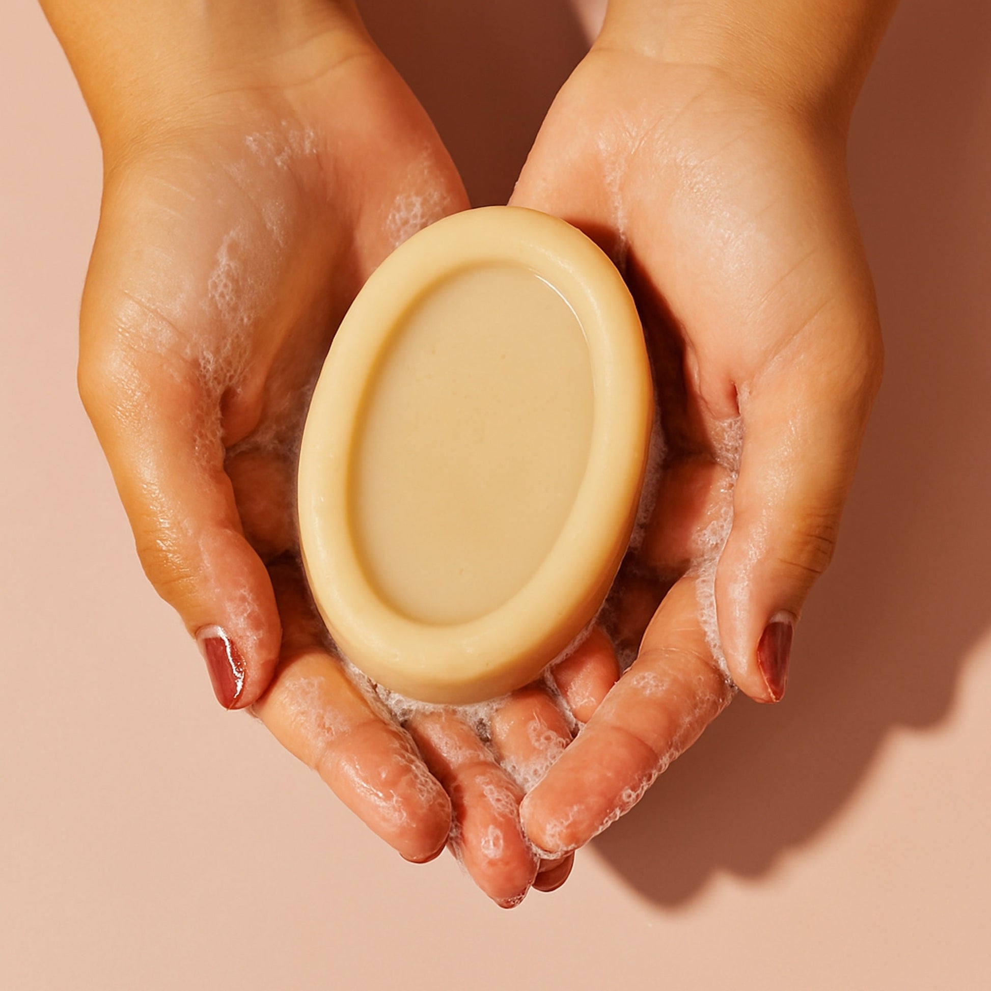 Anti-Wart Soap bar held in hands, promotes natural skincare for wart treatment.